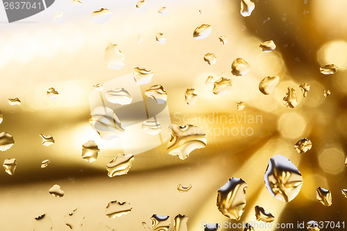 Image of golden abstract background with water drops