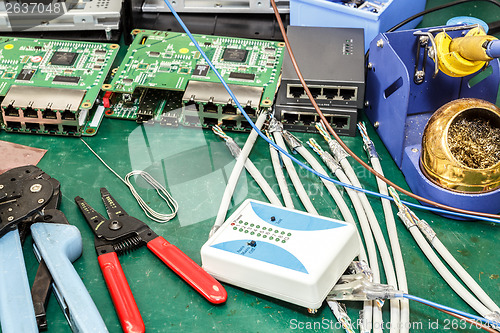 Image of electronics equipment assembly workplace