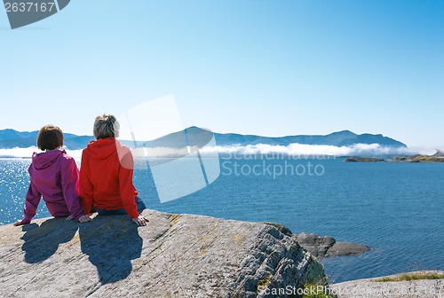 Image of Two women enjoying view at fjord