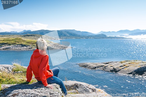 Image of Woman enjoying view at fjord