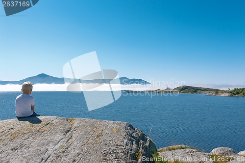 Image of Little boy enjoying view at fjord