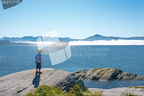 Image of Little boy enjoying view at fjord