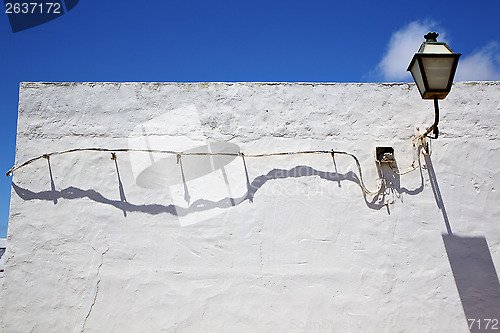 Image of a bulb in the blue sky wall arrecife teguise lanzarote spain