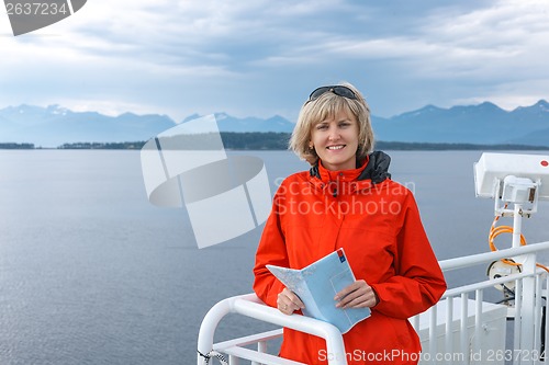 Image of Woman tourist sailing on a sightseeing ferry boat