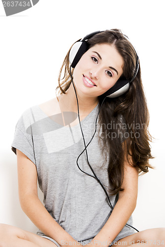 Image of Beautiful woman listen music