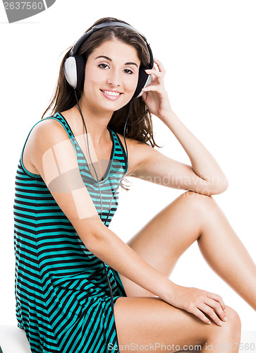 Image of Beautiful woman listen music