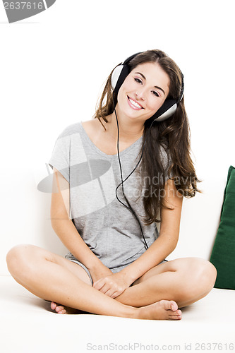 Image of Beautiful woman listen music