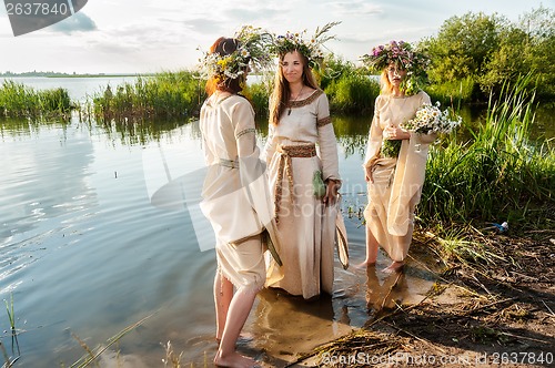 Image of Beautiful women with flower wreath