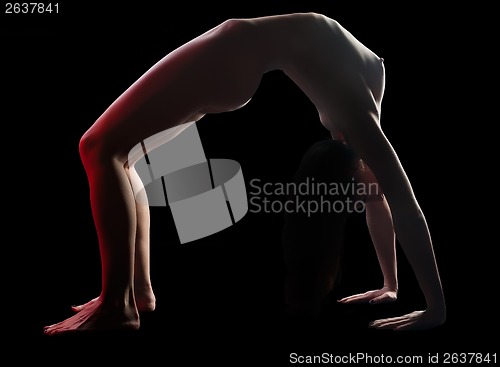 Image of Nude woman in backbend