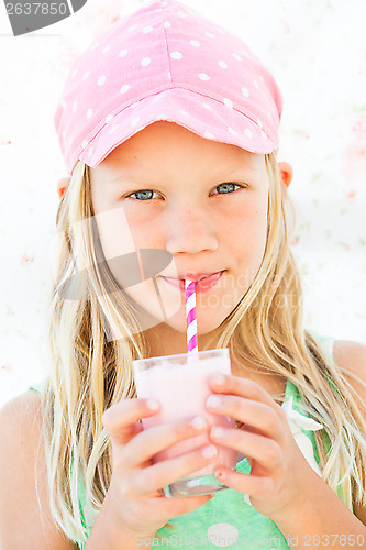 Image of Young girl drinking smoothie