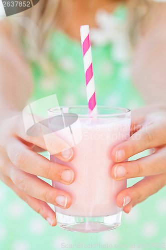 Image of Smoothie drink held by young girl