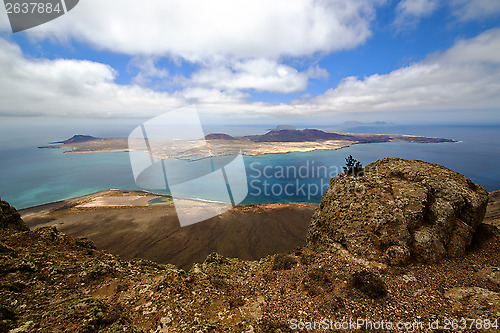 Image of harbor rock stone sky in lanzarote spain graciosa miramar  