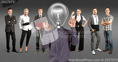 Image of Business Team With Lamp Head