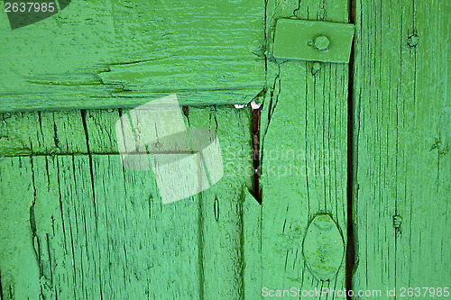 Image of  piece of colorated green wood as a window