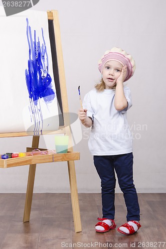 Image of Girl artist paints on canvas