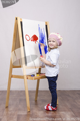 Image of Girl artist paints on canvas