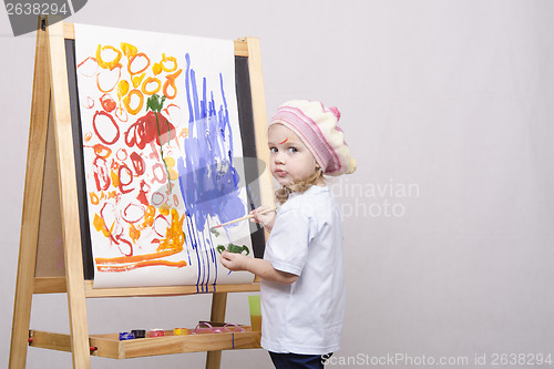 Image of Girl artist paints on canvas