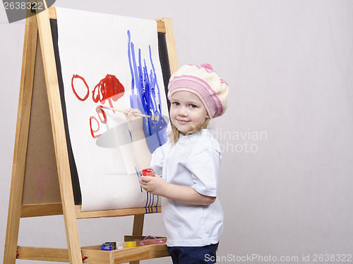 Image of Girl artist paints on canvas