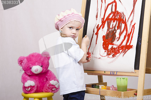 Image of Girl, the artist draws on easel bear