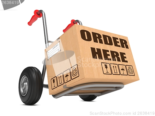 Image of Order Here - Cardboard Box on Hand Truck.