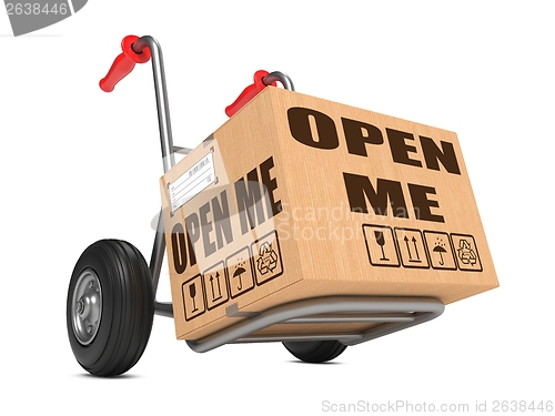 Image of Open Me - Cardboard Box on Hand Truck.