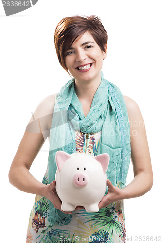 Image of Happy woman with a piggy bank