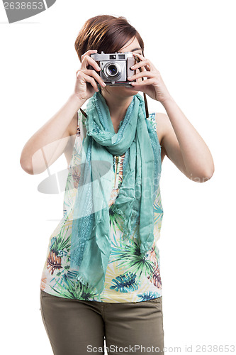 Image of Woman taking a photo with a vintage camera