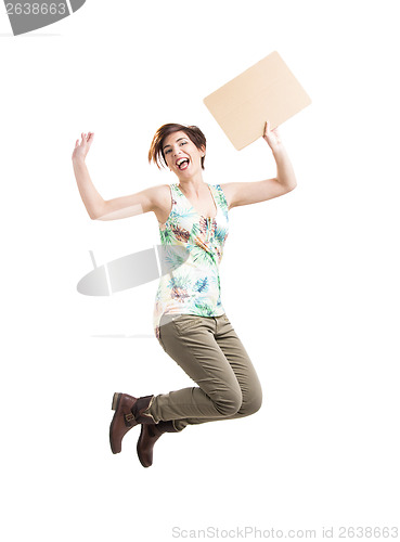 Image of Beautiful woman jumping and holding a cardboard