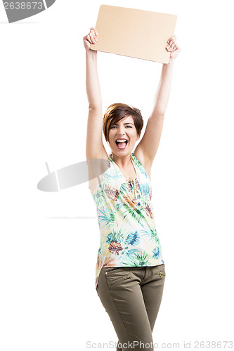 Image of Happy woman holding with a cardboard