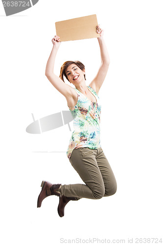 Image of Beautiful woman jumping and holding a cardboard