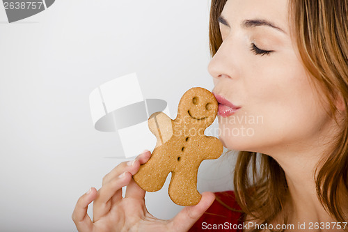 Image of Kissing a gingerbread cookie