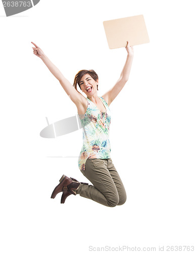 Image of Beautiful woman jumping and holding a cardboard