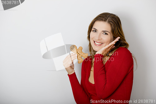 Image of Woman with a Gingerbread cookie
