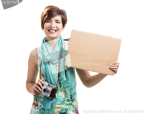 Image of Woman with a vintage camera and a cardboard