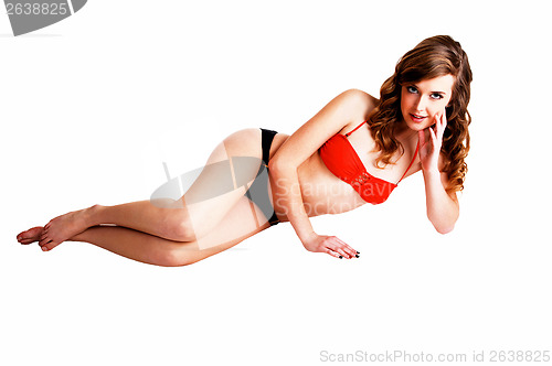 Image of Bikini girl lying.