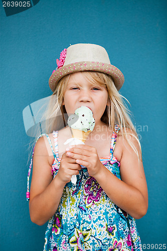 Image of Young girl eating ice cream