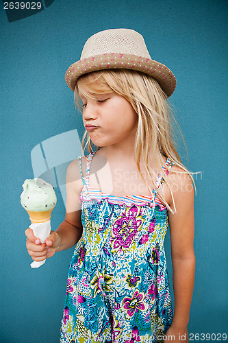 Image of Young girl holding ice cream cone