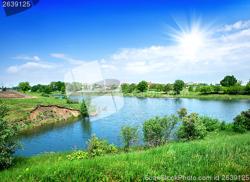 Image of Sun over river