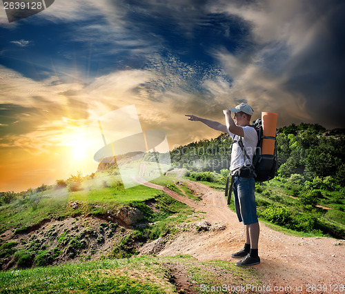 Image of Tourist on the road in mountains