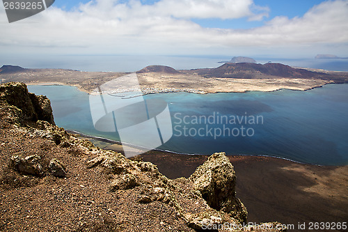 Image of harbor rock stone sky cloud beach   spain graciosa miramar del r