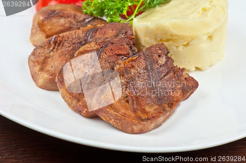 Image of tongue with grilled vegetable