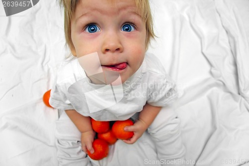 Image of little boy with oranges