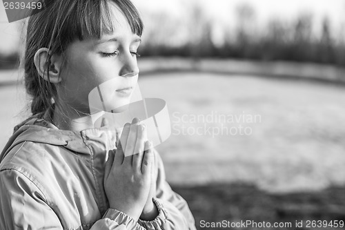 Image of Young girl praying