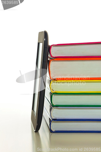 Image of Electronic book reader with hard cover books