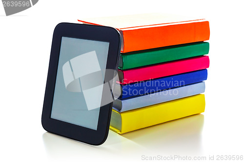 Image of Electronic book reader with hard cover books