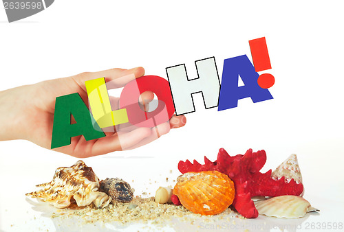Image of Female hand holding colorful word Aloha