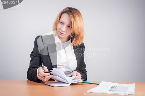 Image of Young red-haired businesswoman