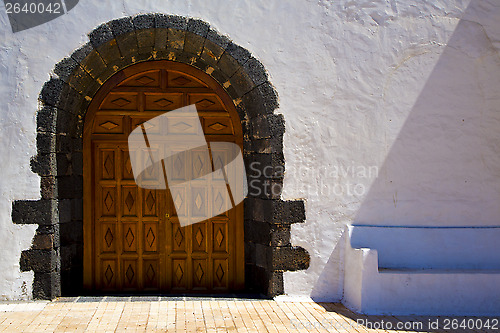 Image of  a brown closed wood  church door   spain canarias