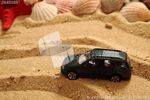 Image of small toy car in the sand