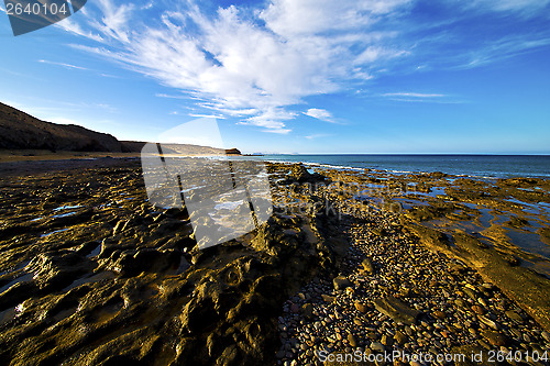 Image of rock cloud beach  water  coastline and summer in lanzarote 